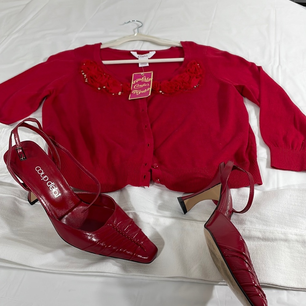 Candies scoop neck sweater with rosette trim and red Pearl button down front